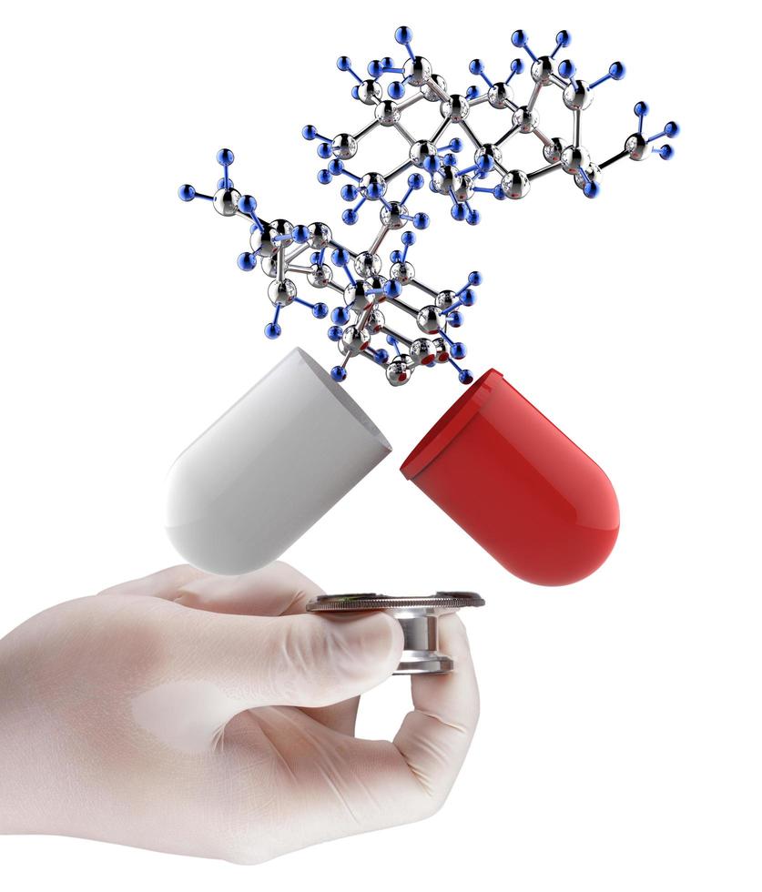 Stethoscope in hand with capsule pill and molecule photo