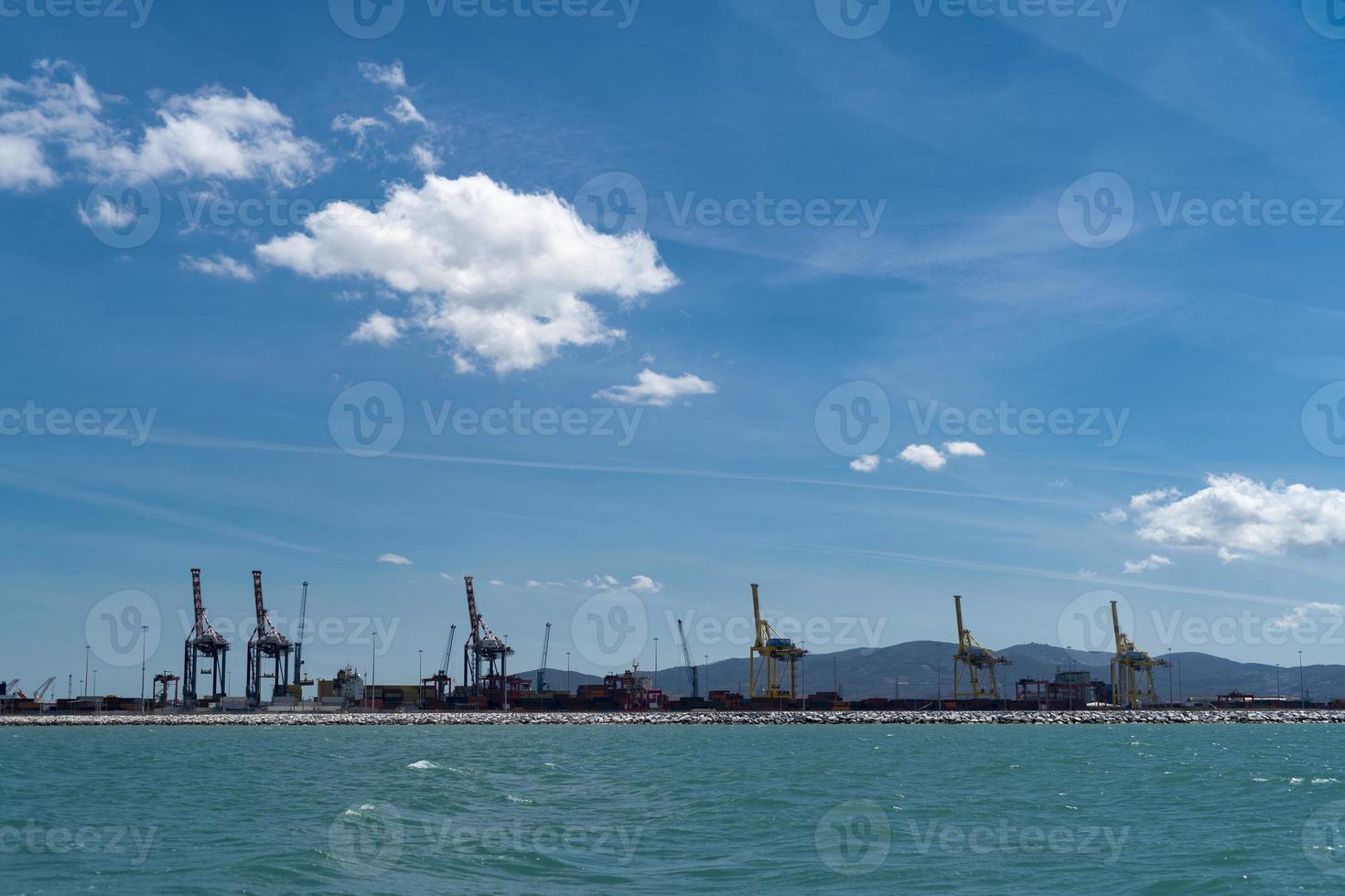 The commercial port of Livorno seen from the sea photo