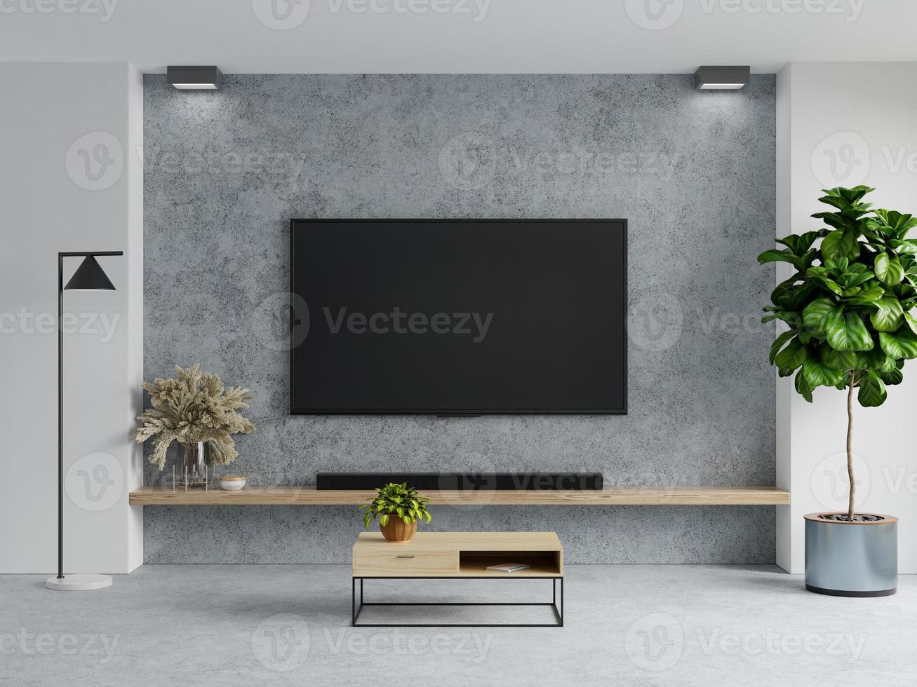 Concrete wall mounted tv in living room interior on concrete background.  9837044 Stock Photo at Vecteezy