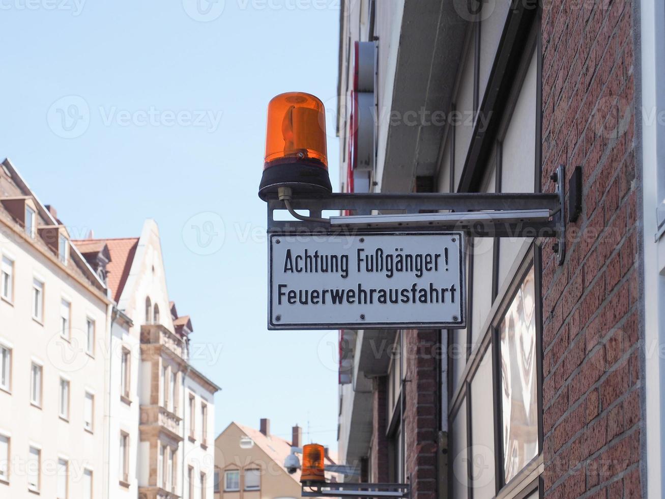 German pedestrians beware fire department exit sign photo