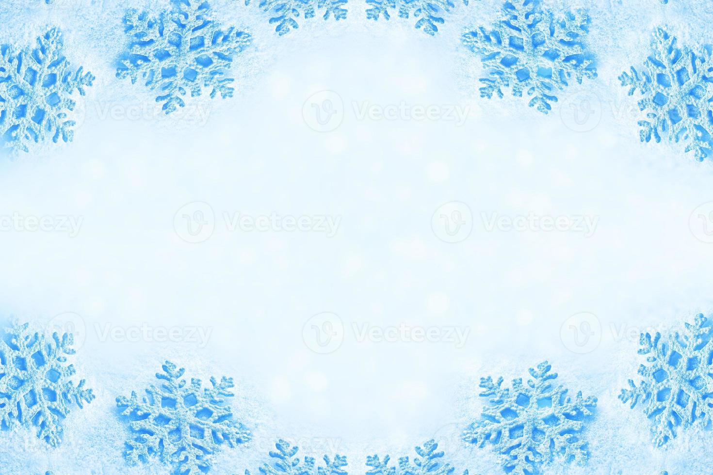 White fluffy snowflakes on snow. Winter christmas background. photo