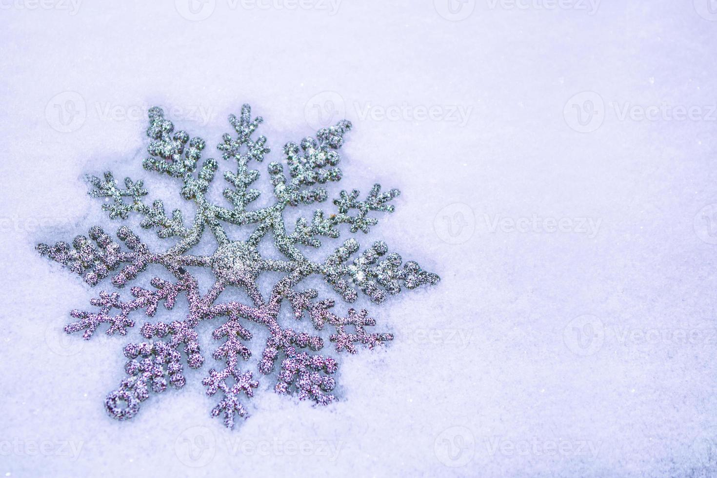 White fluffy snowflakes on snow. Winter christmas background. photo