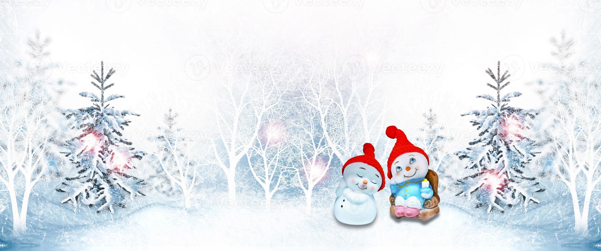 Happy snowman on a winter landscape background. photo