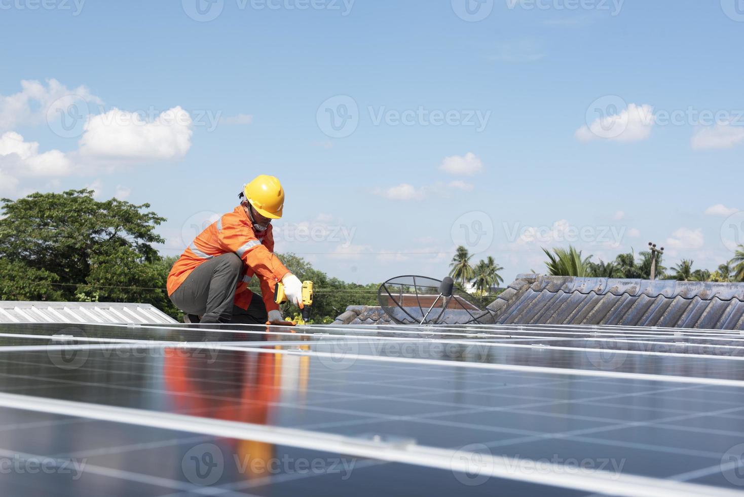 engineer inspecting solar panel installation on house roof solar panel maintenance inspector photo