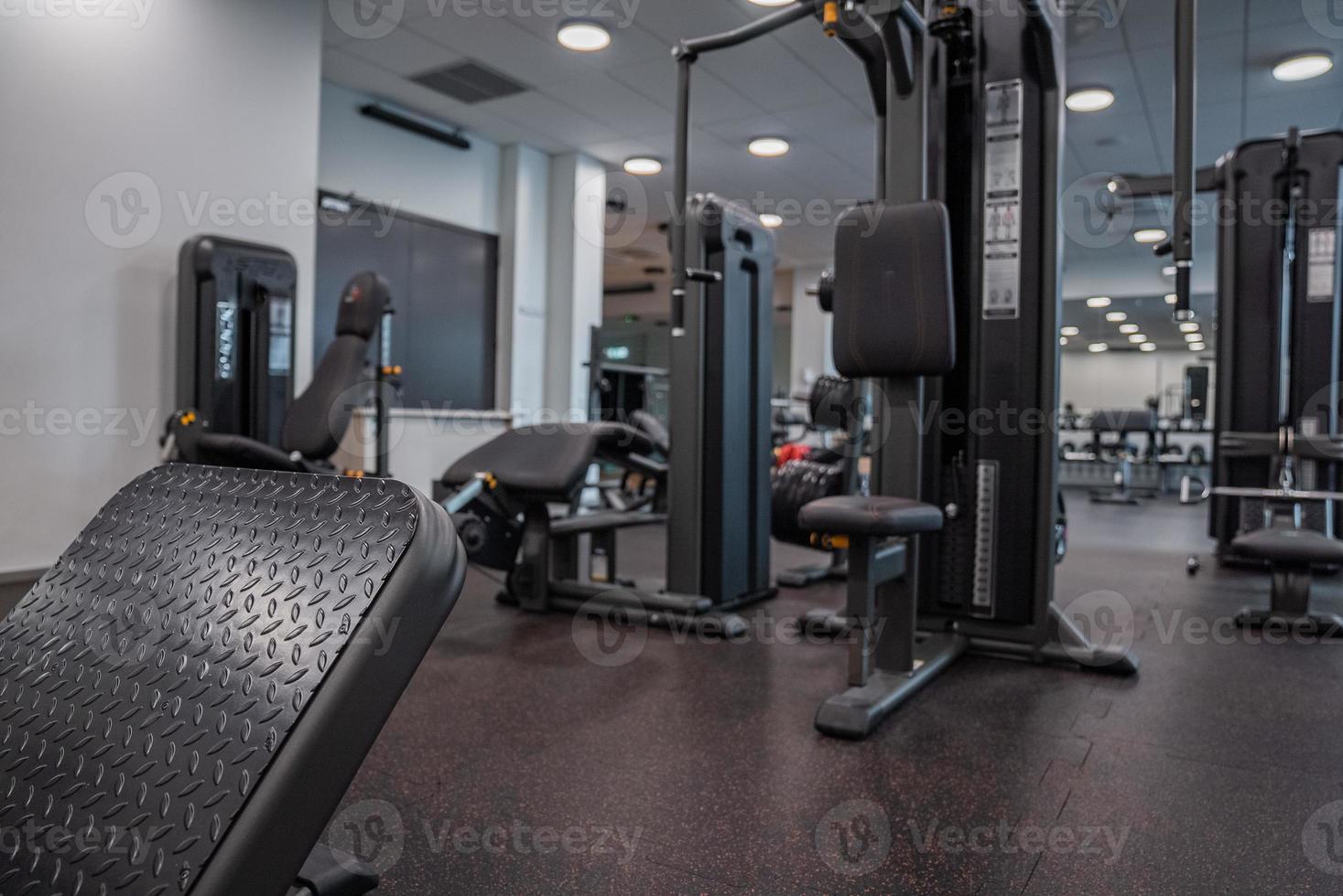 Modern light gym. Sports equipment in gym. photo