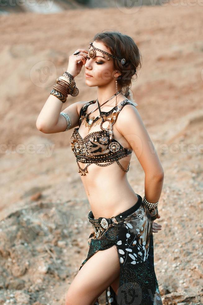 Pretty woman in tribal fusion costume near the beautiful white fairy tree.  9856758 Stock Photo at Vecteezy