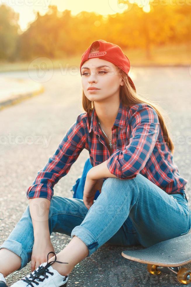 Skateboarding woman sunrise photo