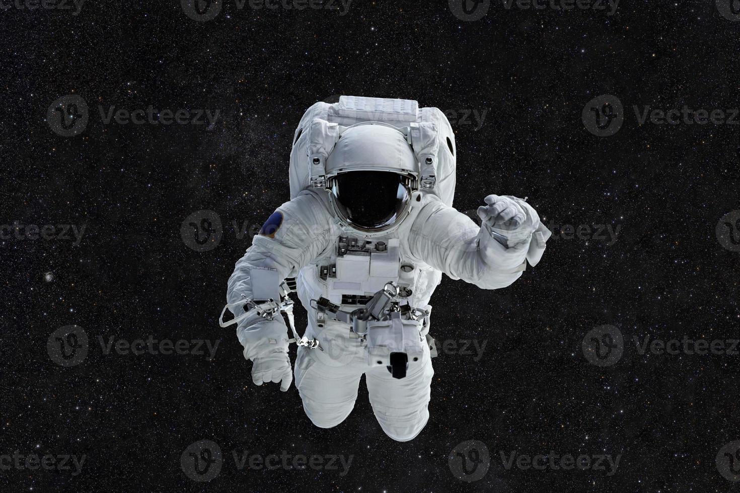 Spaceman travels on a background of stars. Astronaut outer space photo