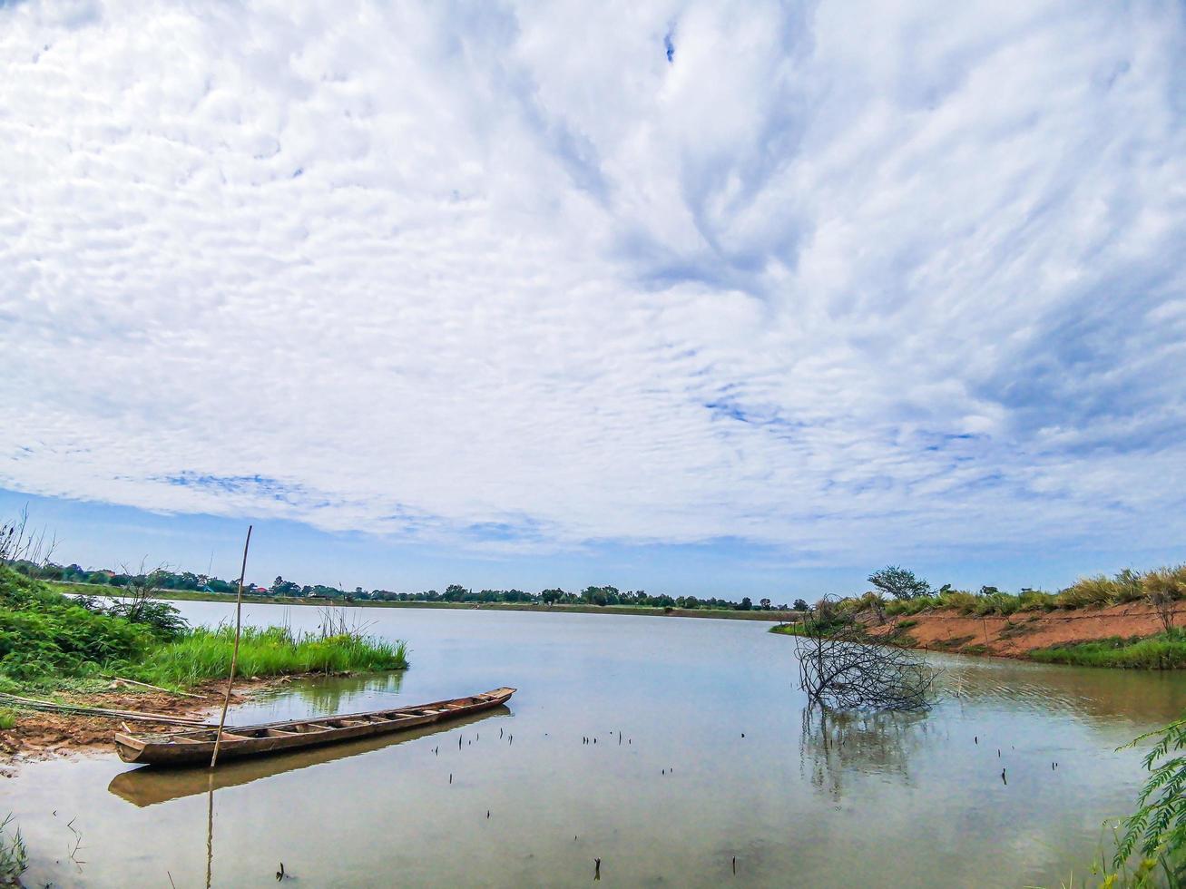 boat moored at port sky and clouds photo