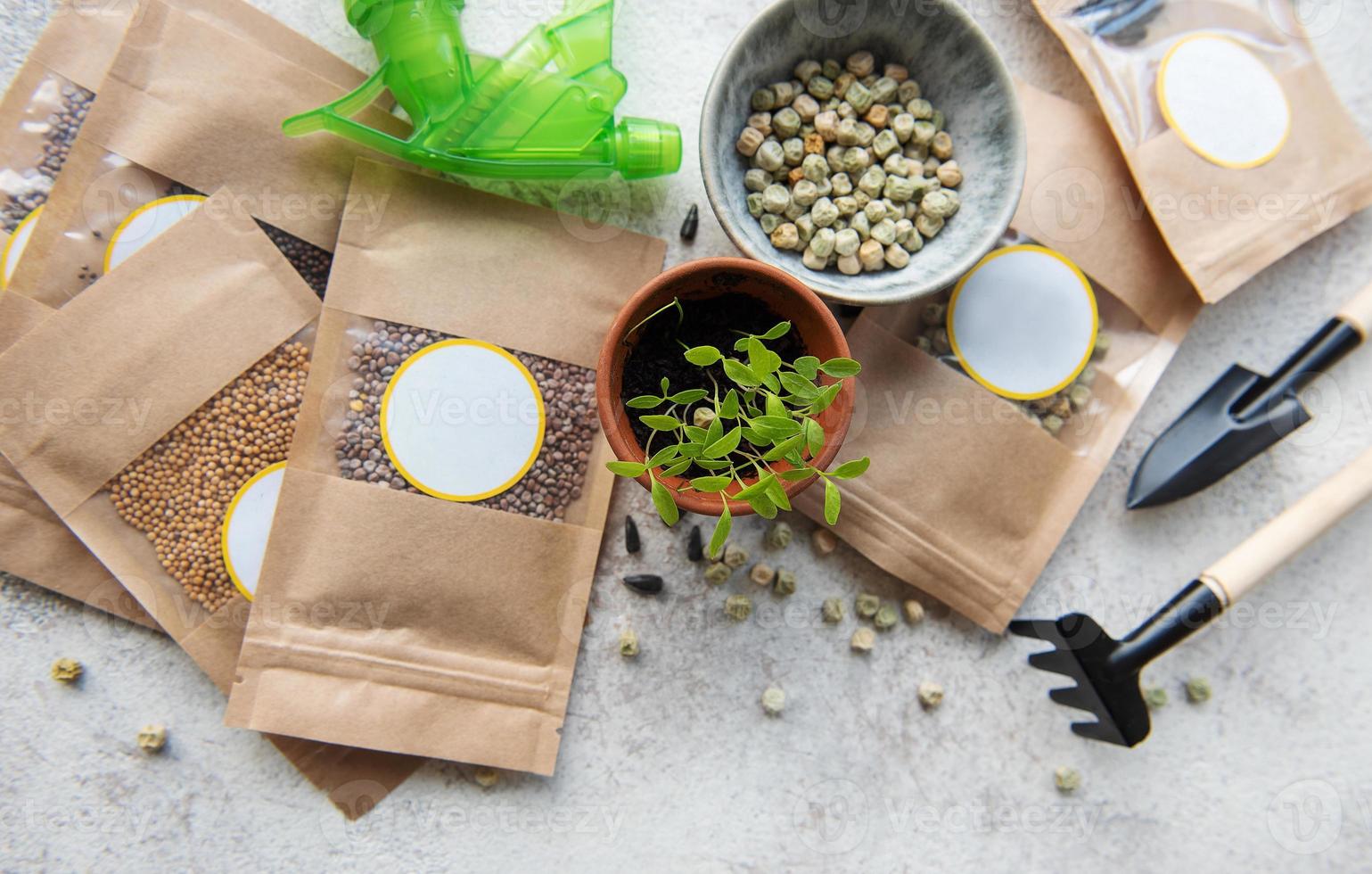 Microgreen seeds in paper bags and equipment for sowing microgreens. photo