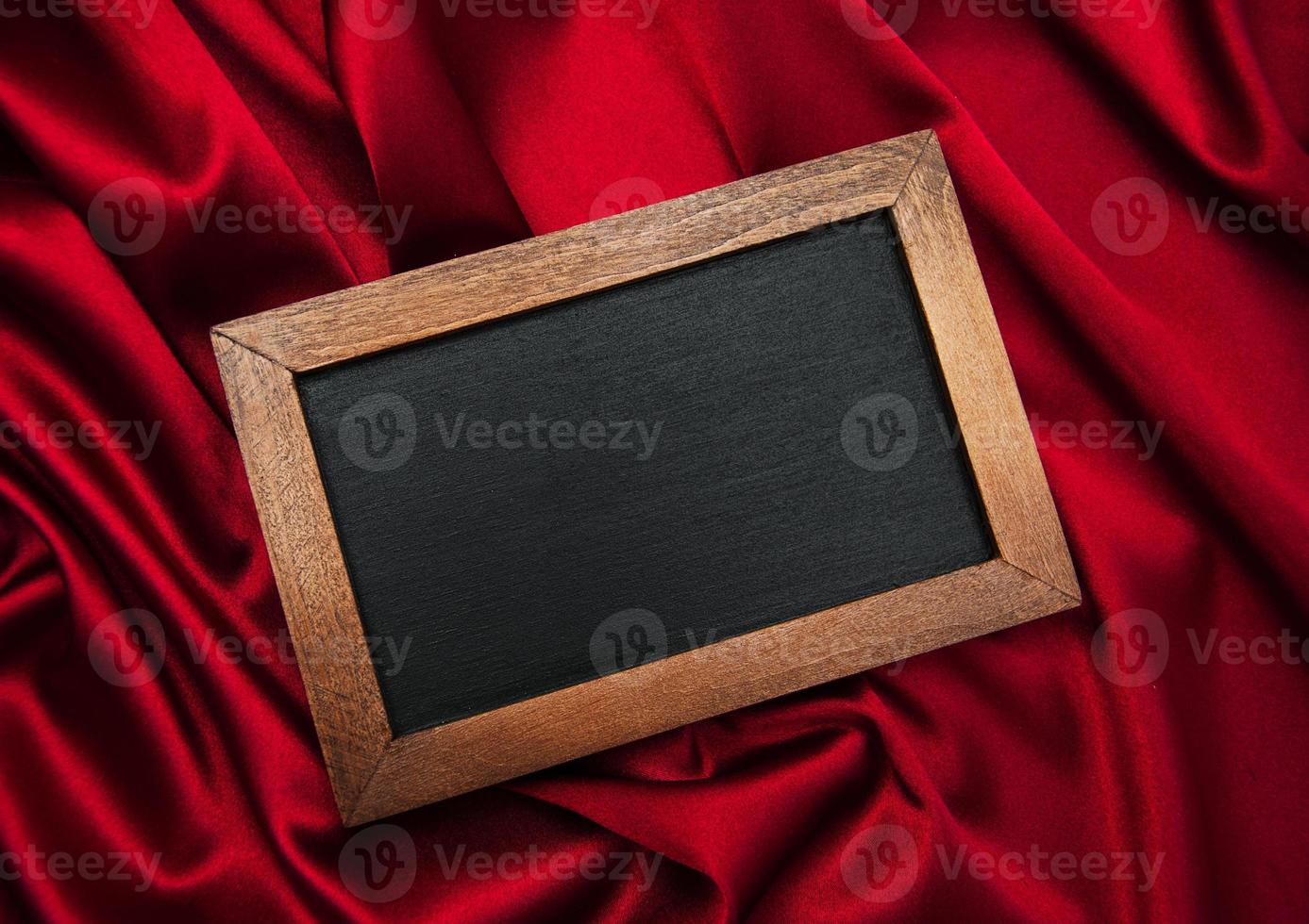 Blackboard on a red silk photo