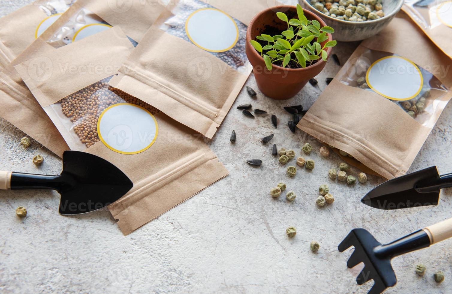 Microgreen seeds in paper bags and equipment for sowing microgreens. photo