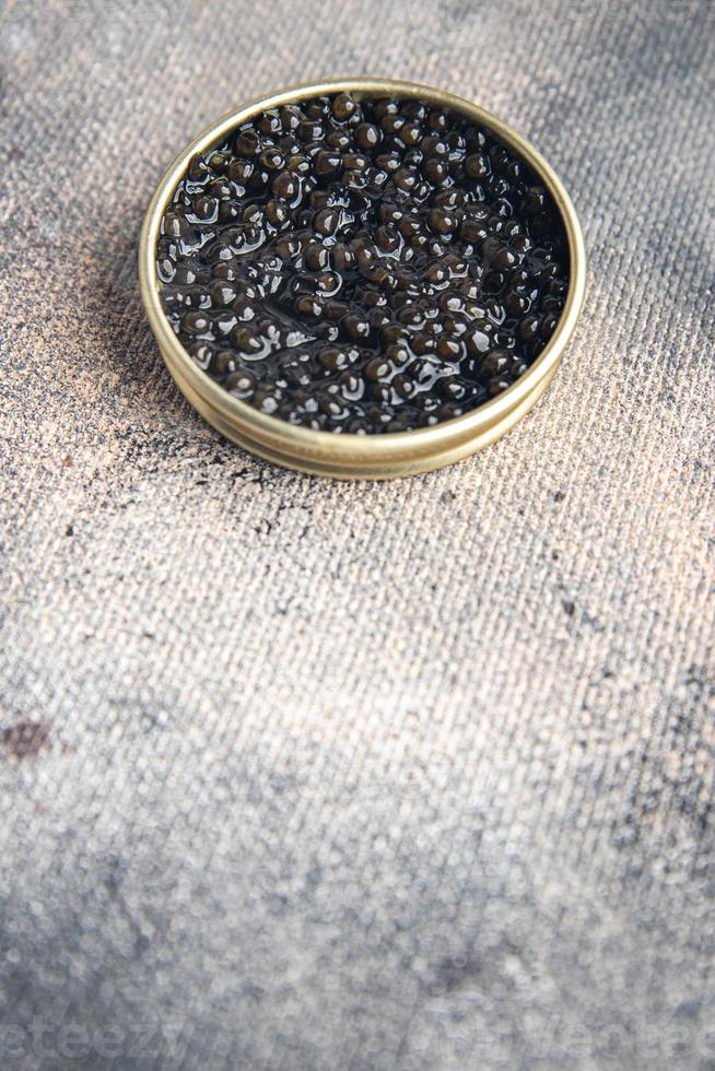 caviar black sturgeon fish beluga, stellate sturgeon fresh healthy meal food snack on the table copy space food background photo