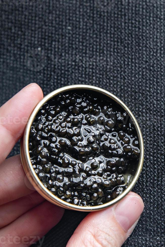 caviar black sturgeon fish beluga, stellate sturgeon fresh healthy meal food snack on the table copy space food background photo