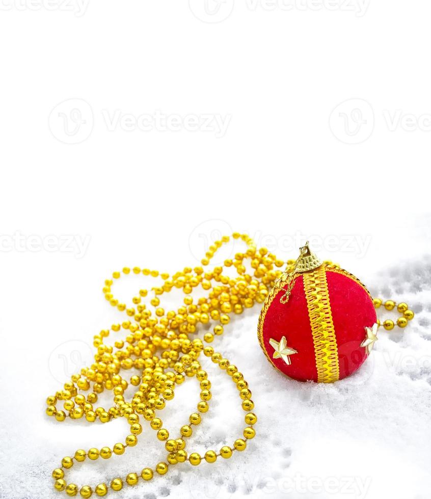 Christmas decoration. Festive Christmas card. Toy ball in the snow. photo