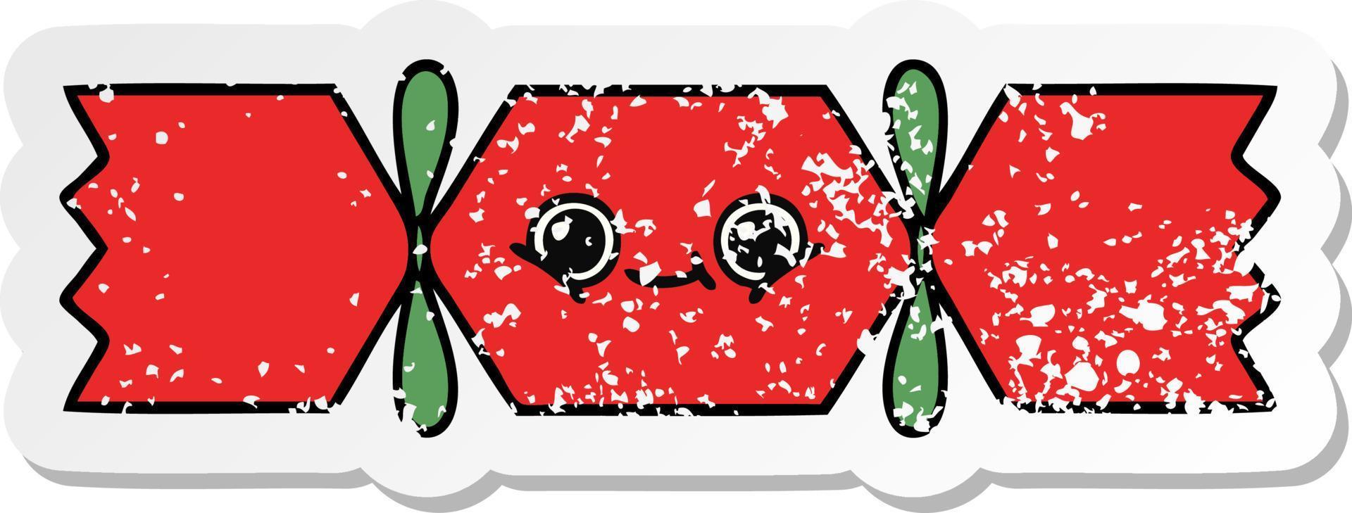 distressed sticker of a cute cartoon christmas cracker vector