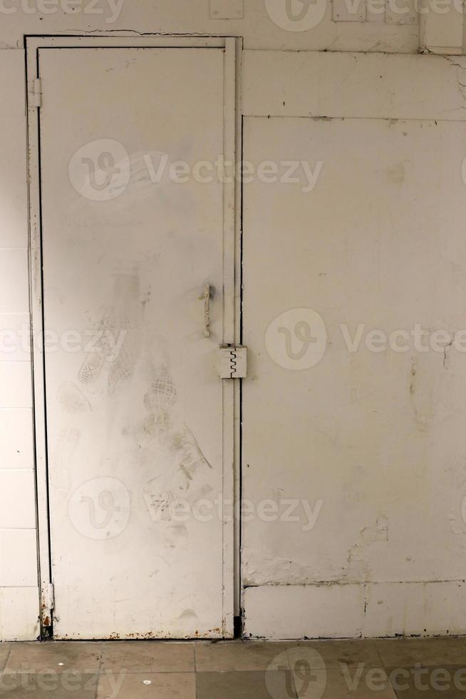 A door is an opening in a wall to enter and exit a building. photo