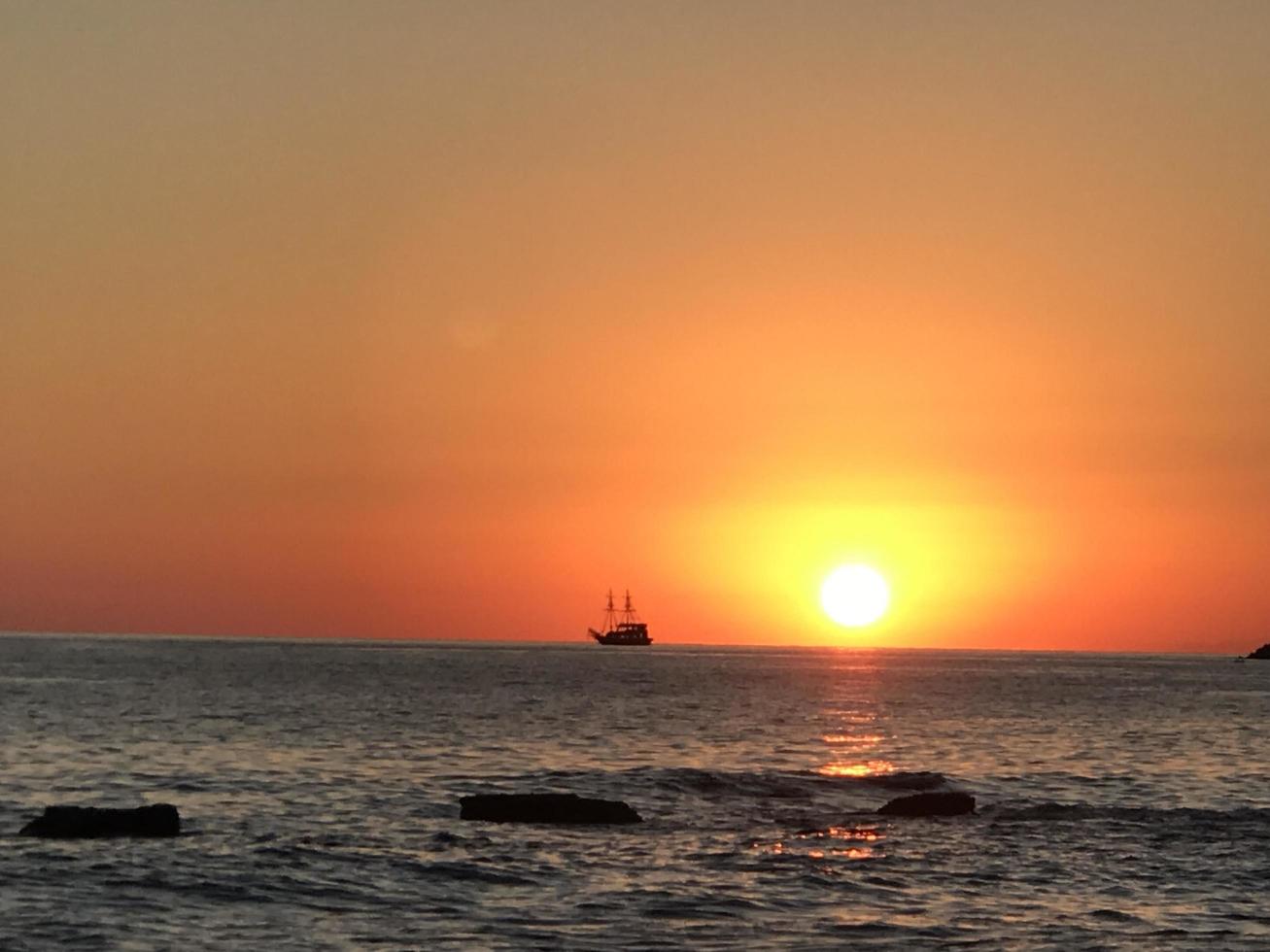 Sunset Sea with boat photo