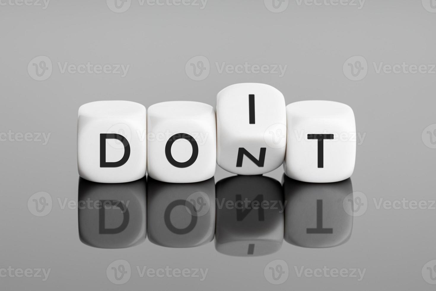 Flip cube block with word dont change to do it. Negative mindset to positive thinking concepts photo