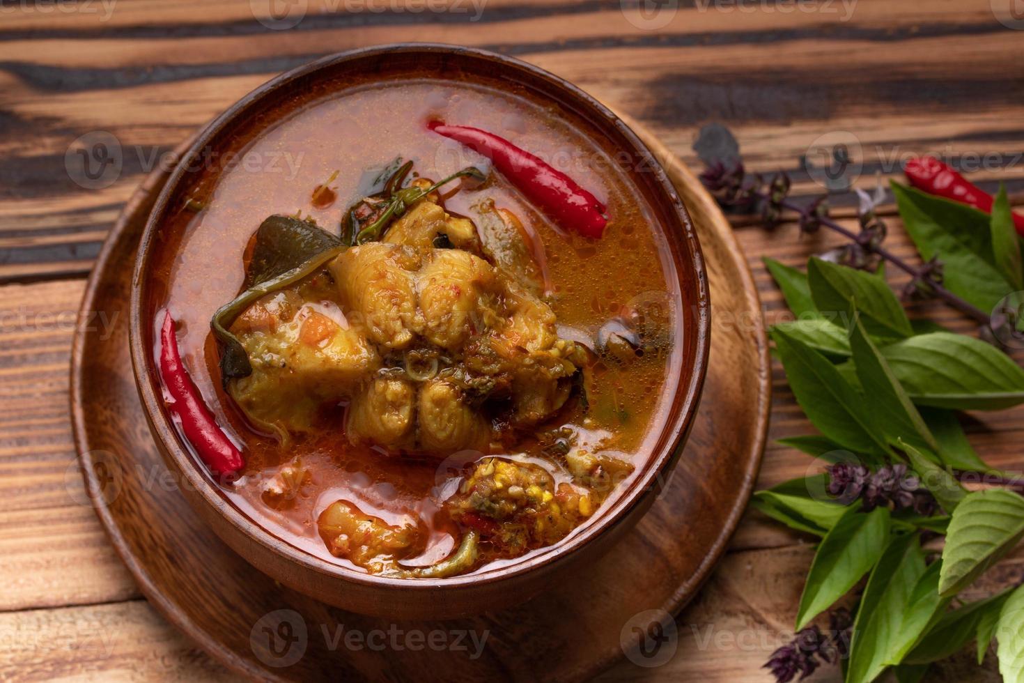 Catfish Curry. Thai food on dark background. Traditional food concept. Top View, Flat Lay, Copy Space photo