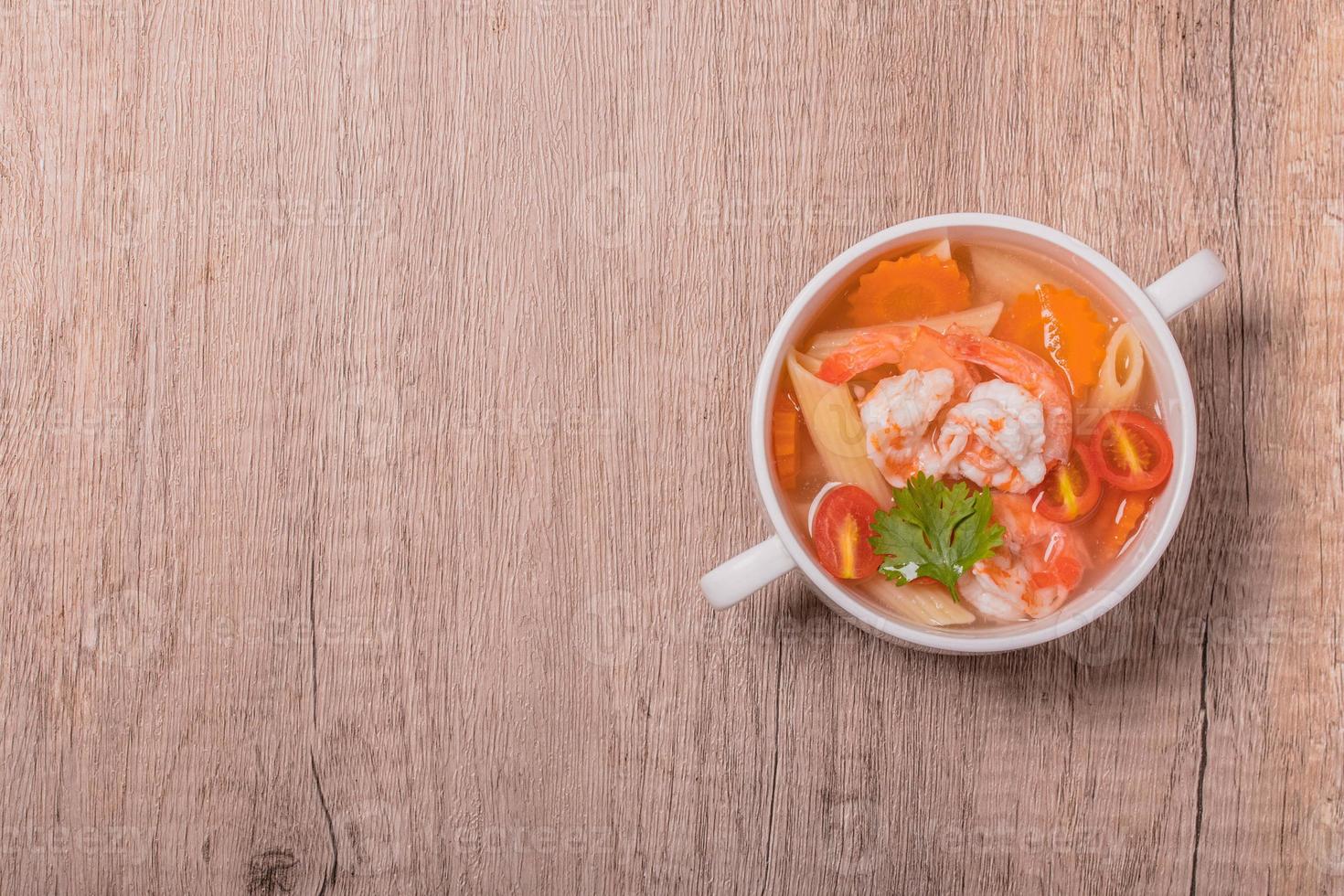 Shrimp and Vegetable Macaroni Soup in White Bowl photo