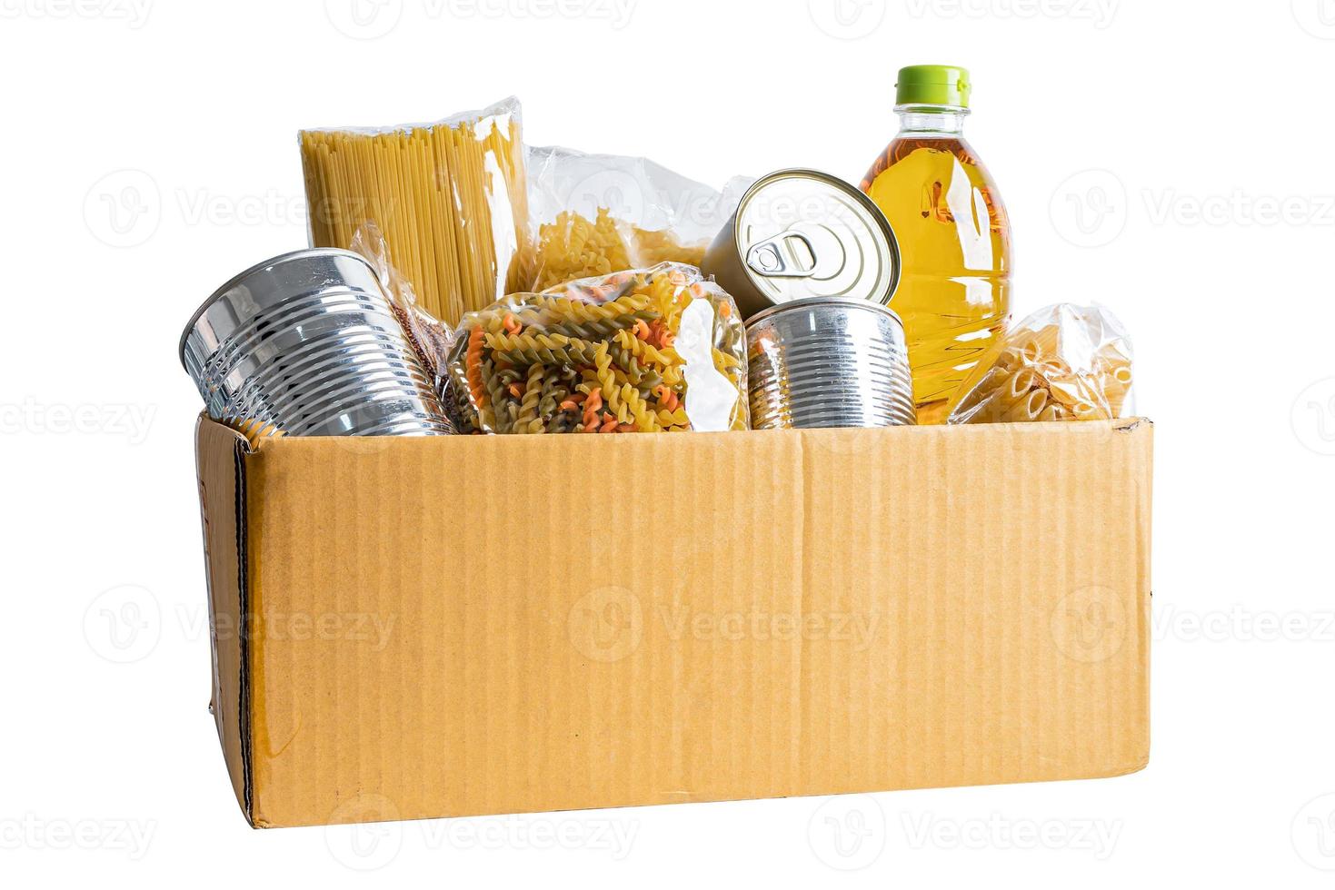 Foodstuff for donation, storage and delivery. Various food, pasta, cooking oil and canned food in cardboard box. photo