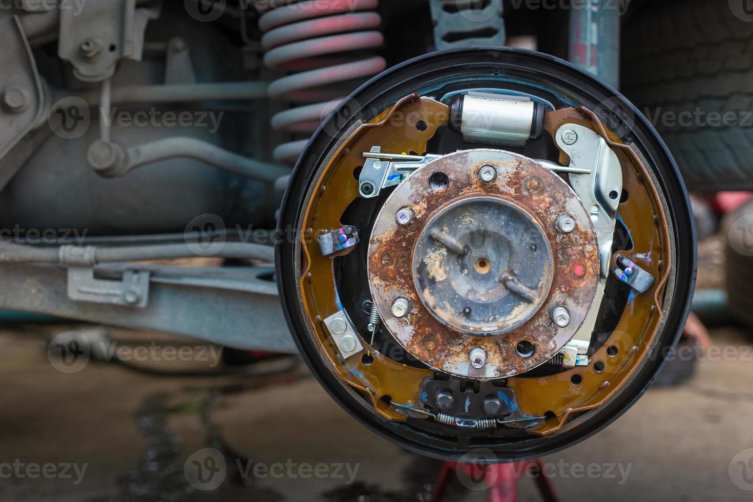 Maintenance repair and cleaning drum brake and asbestos brake pads it's a part of car use for stop the car for safety at rear wheel this a new spare part for repair at car garage photo