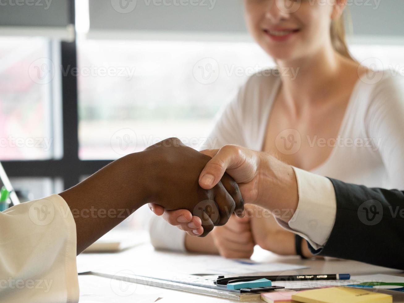 Businessman businesswoman diversity african person hand shake agreement business contract work job career colleague partner corporate negotiation happy smile strategy team successful photo