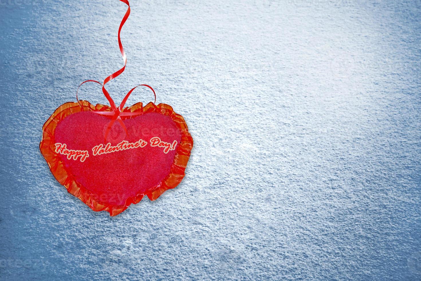 Background from snow. Heart. photo