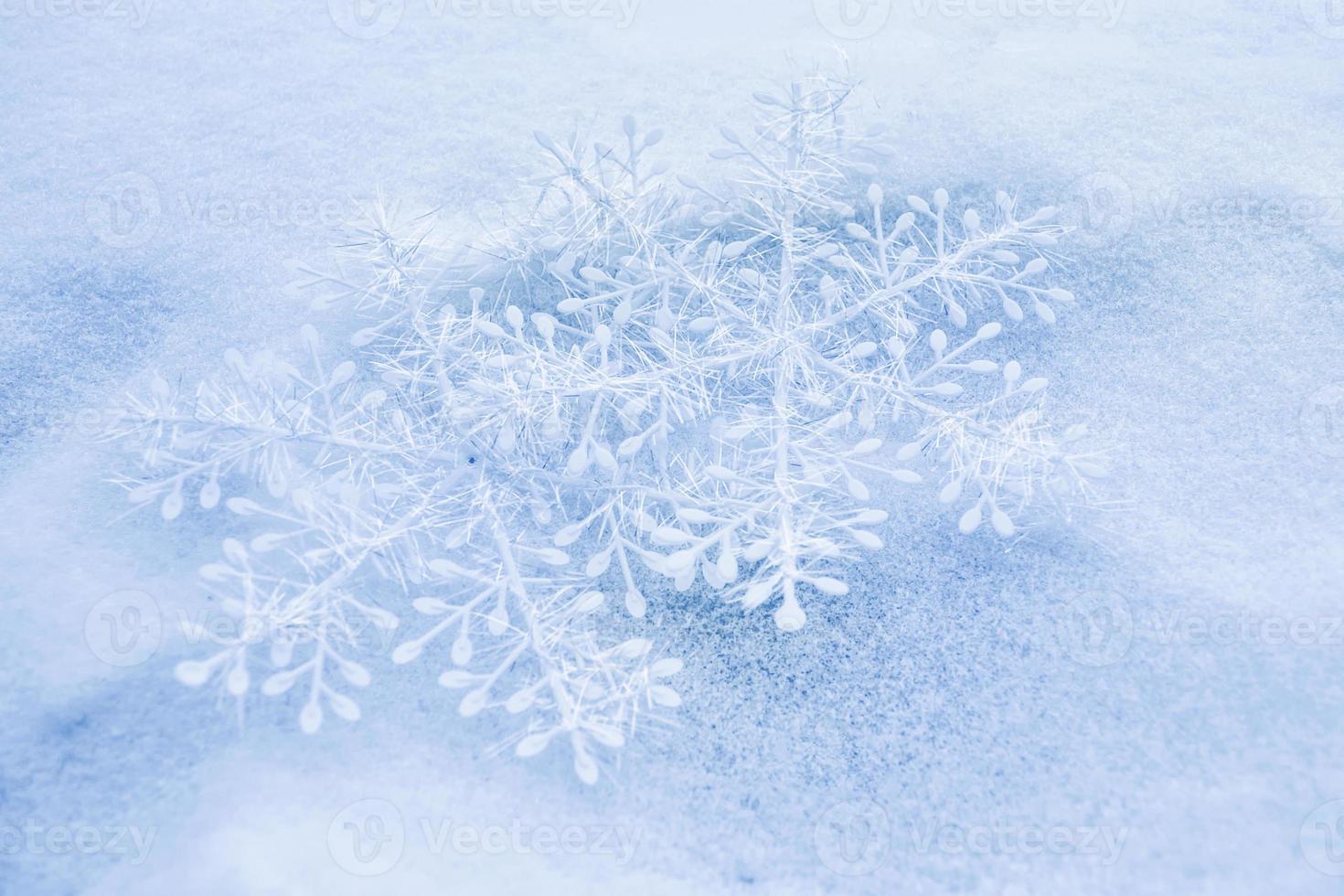 White fluffy snowflakes on snow. Winter christmas background. photo