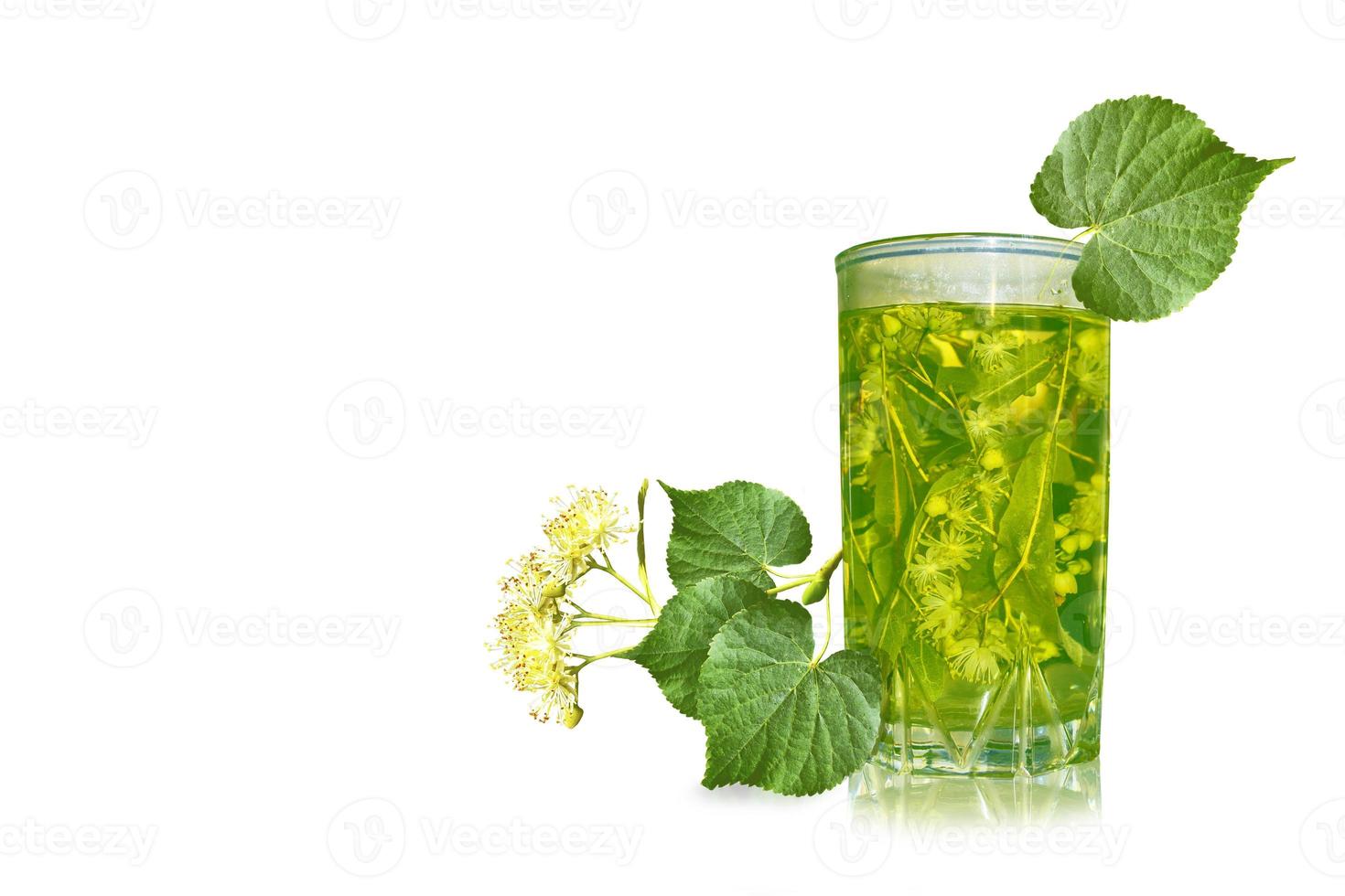 Lime glass of hot tea. Floral background. photo