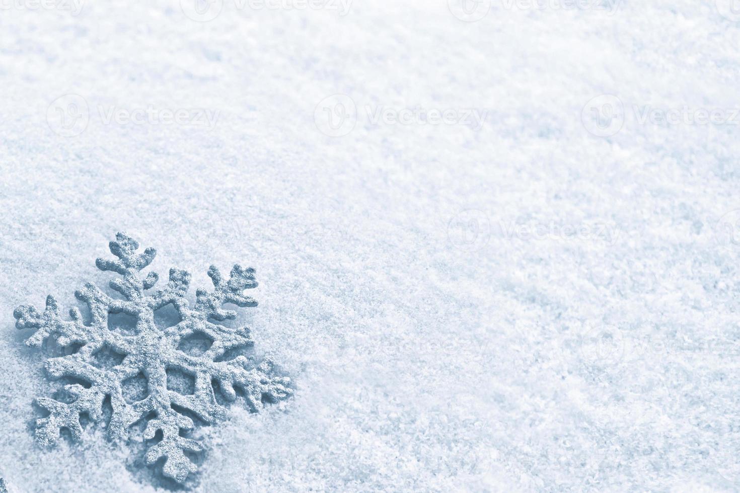 White fluffy snowflakes on snow. Winter christmas background. photo