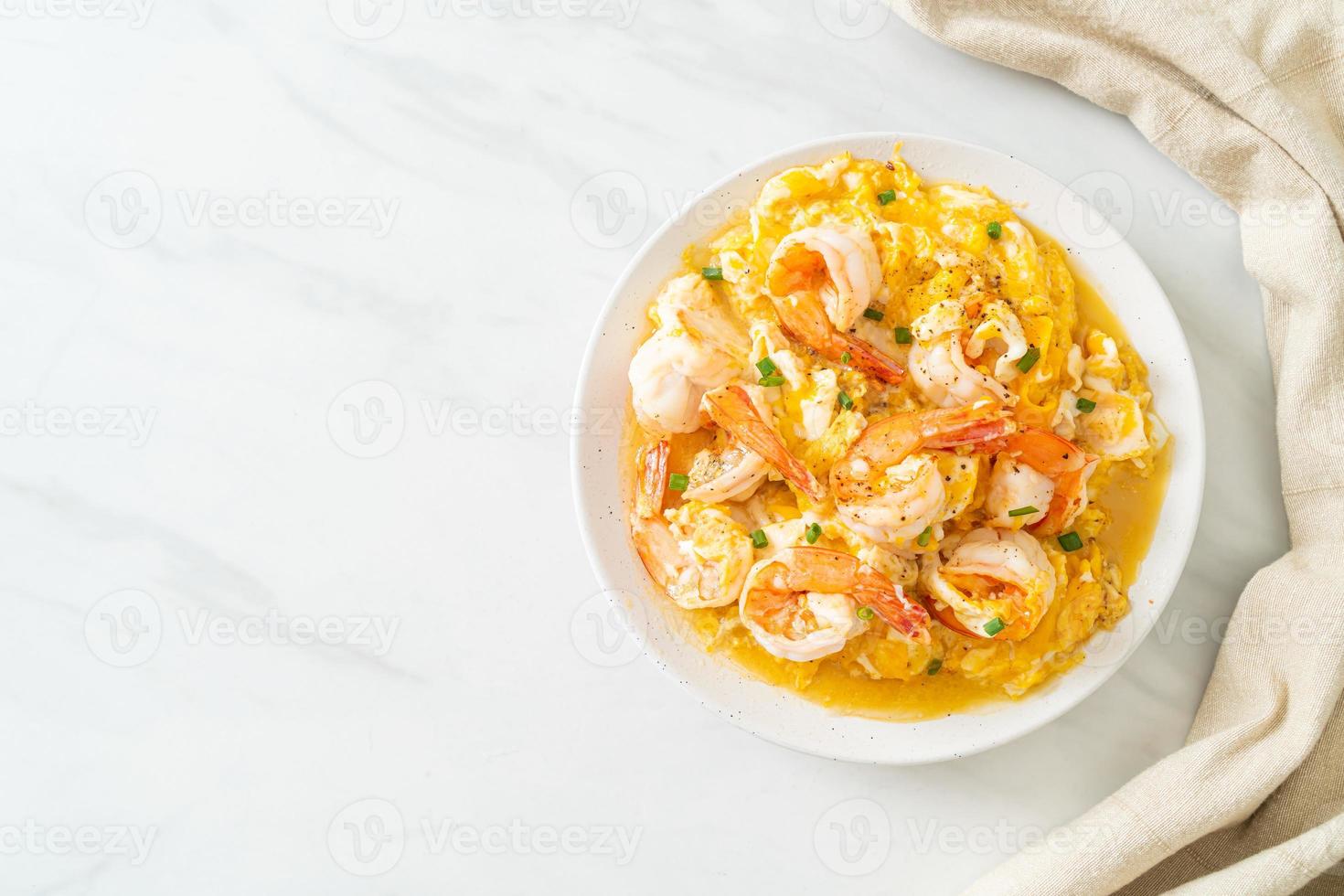 creamy omelet with shrimps or scrambled eggs and shrimps photo