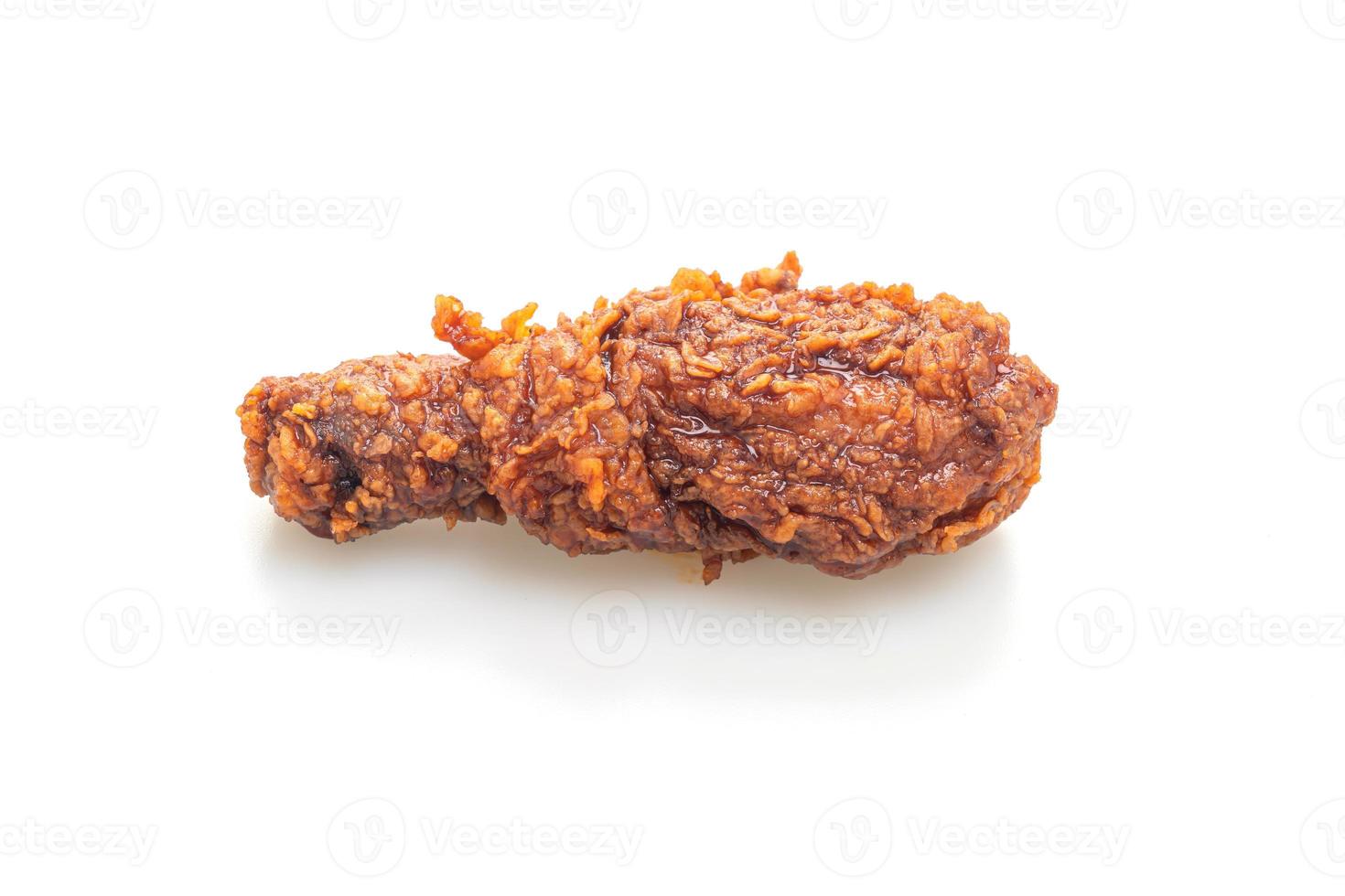 fried chicken with spicy Korean sauce on white background photo