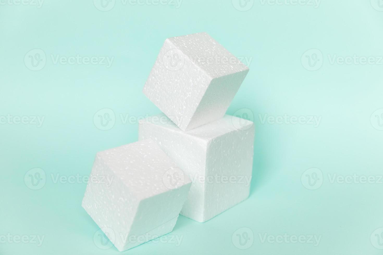 White rectangular cube shapes on blue background. Minimal boxes geometric forms podium. Empty unbranded shopfront. Showcase for cosmetic product. Mockup style design. Cosmetology and beauty concept. photo