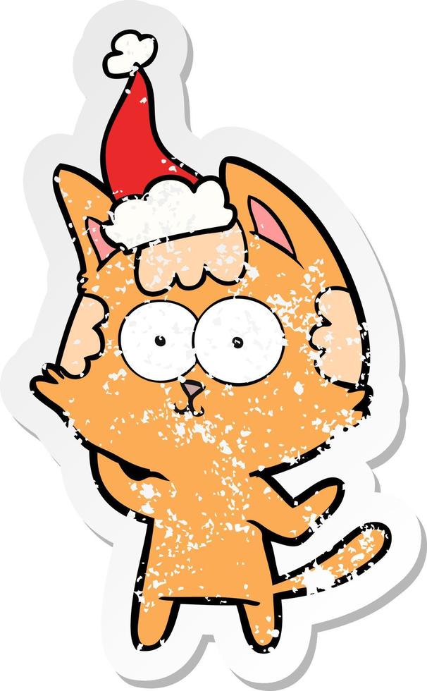 happy distressed sticker cartoon of a cat wearing santa hat vector