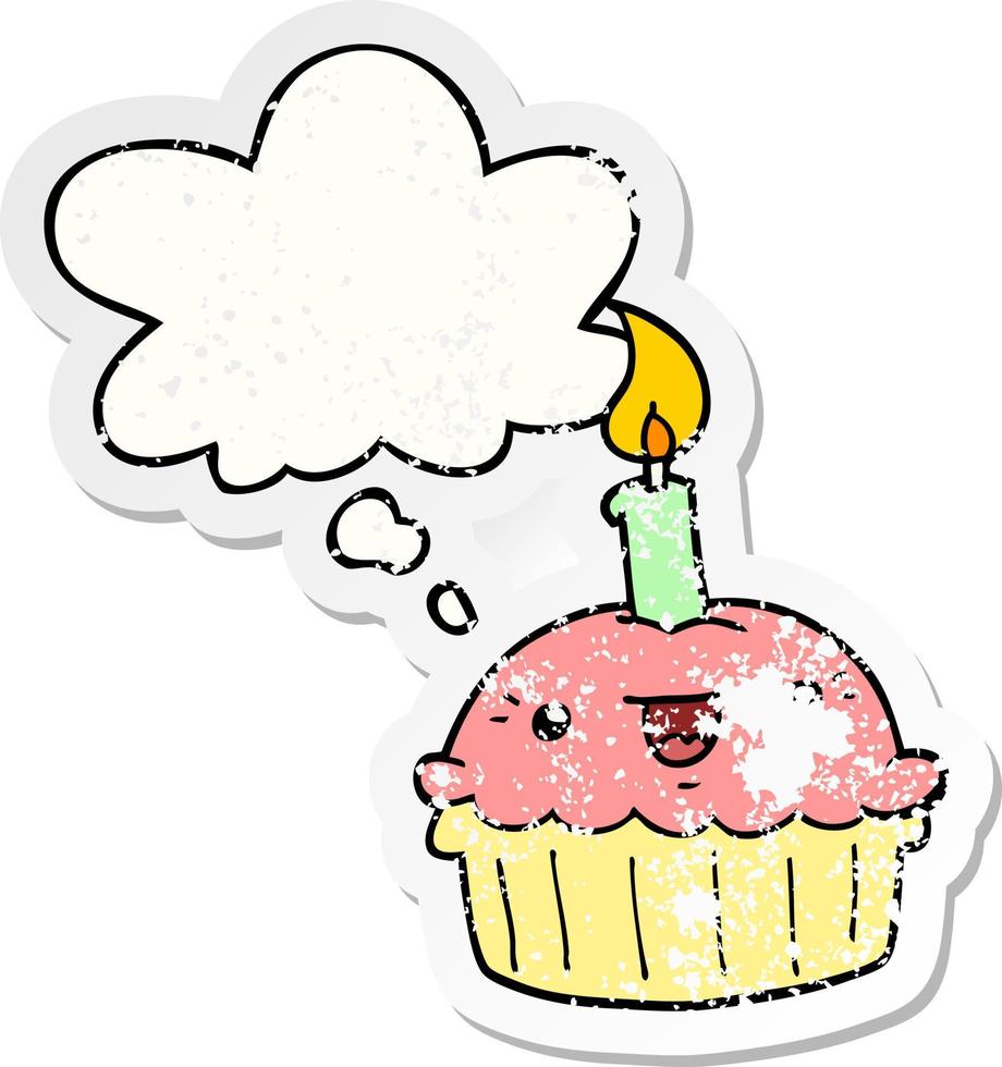 cartoon cupcake with candle and thought bubble as a distressed worn sticker vector