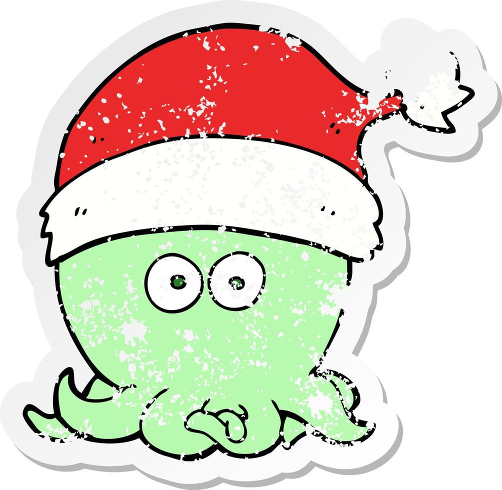 distressed sticker of a cartoon octopus wearing christmas hat vector