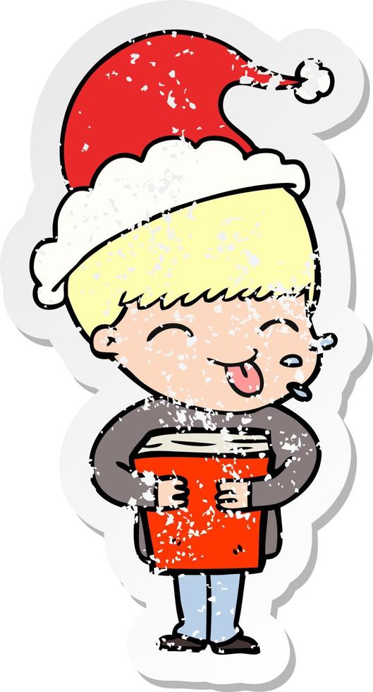 distressed sticker cartoon of a boy wearing santa hat vector