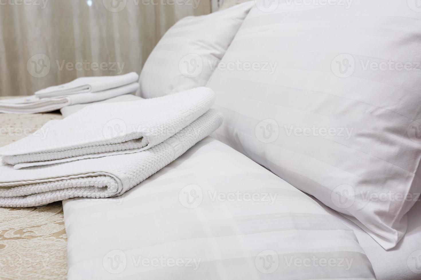 pillows on the bed in Interior of the modern bedroom in loft flat apartments in light color style photo