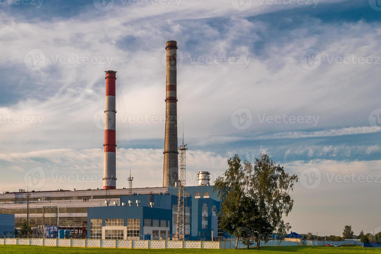 pipes of a chemical enterprise plant. Air pollution concept. Industrial landscape environmental pollution waste of thermal power plant photo
