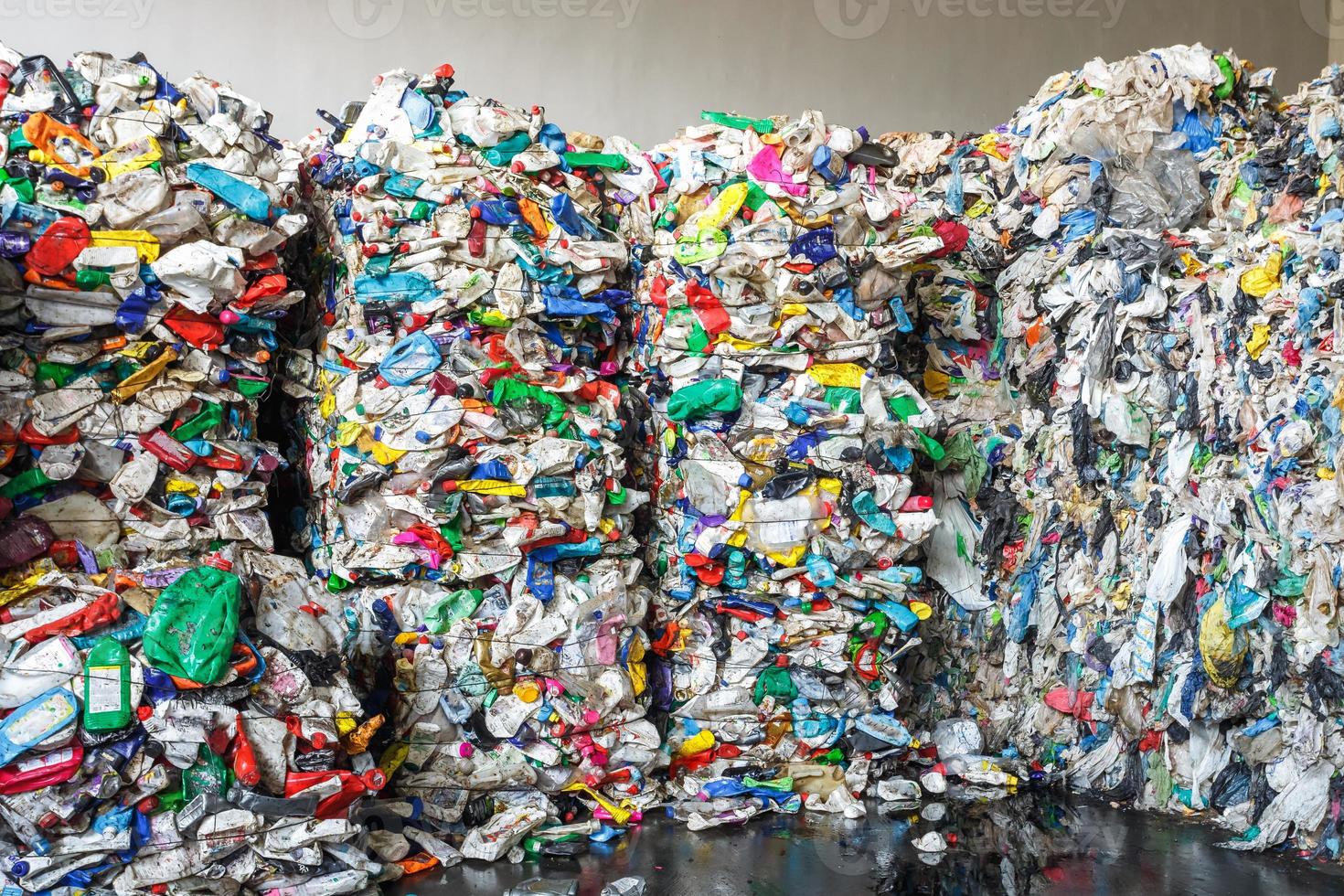 Plastic bales at the waste processing plant. Separate garbage collection. Recycling and storage of waste for further disposal. Business for sorting and processing of waste. photo