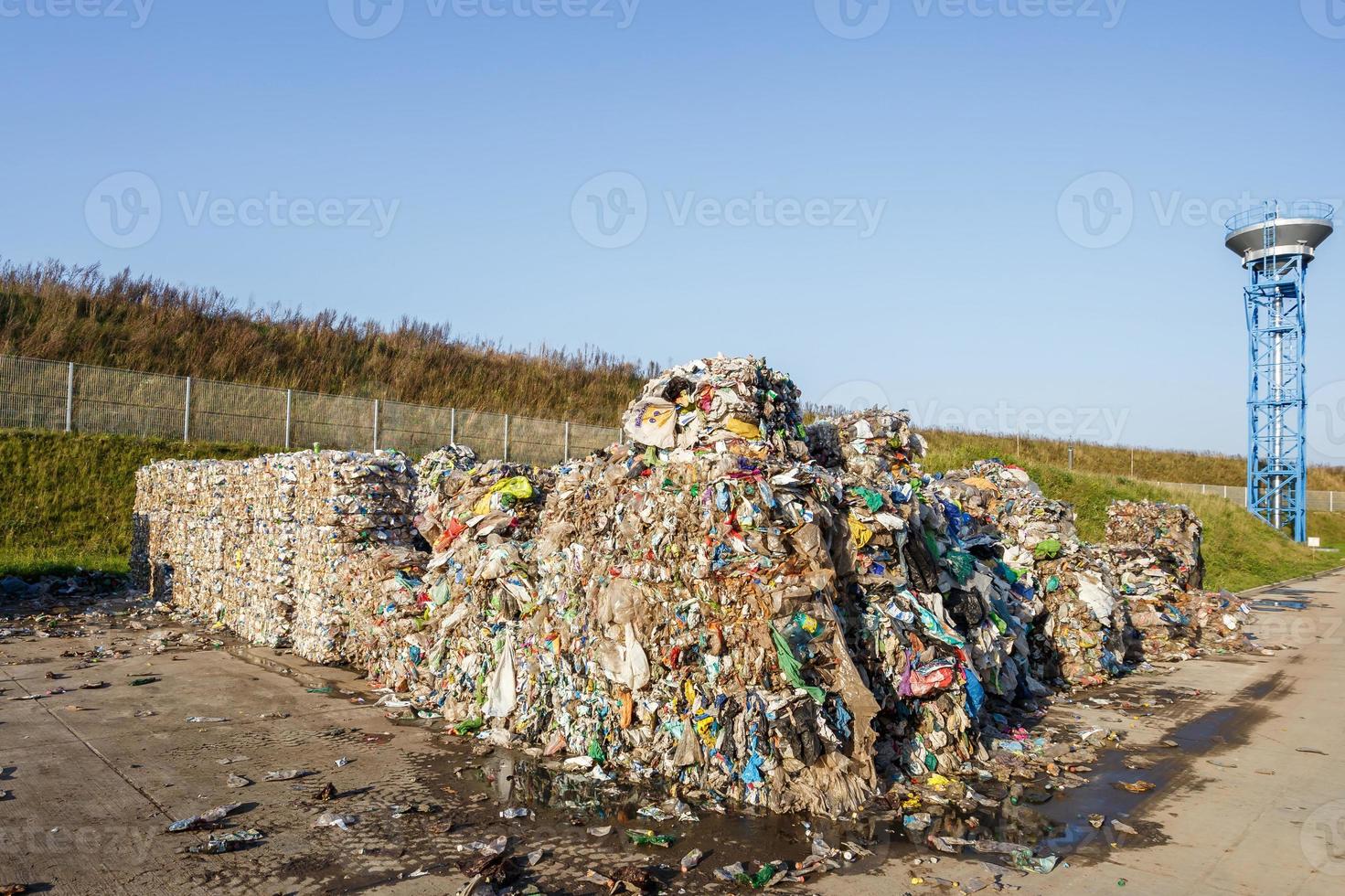 Plastic bales at the waste processing plant. Separate garbage collection. Recycling and storage of waste for further disposal. Business for sorting and processing of waste. photo