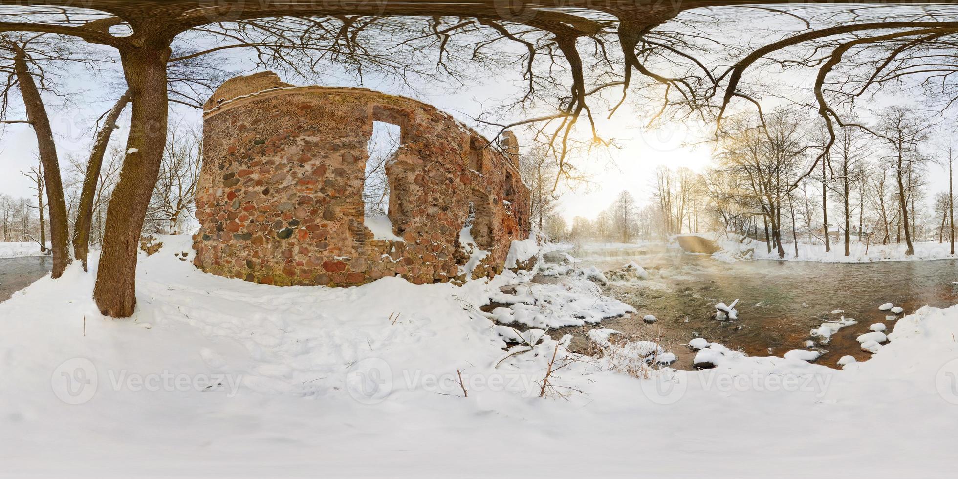 full seamless spherical panorama 360  degrees angle view near ruined water mill narrow fast river in a winter sunny evening. 360 panorama in equirectangular projection. VR AR virtual reality content photo