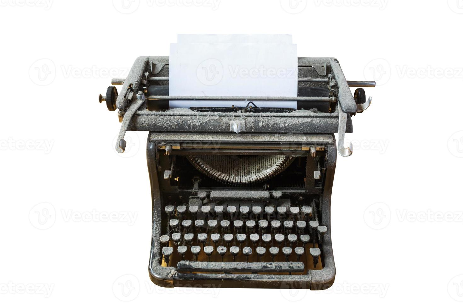 old vintage dust-covered typewriter with sheet of paper isolated on white background photo