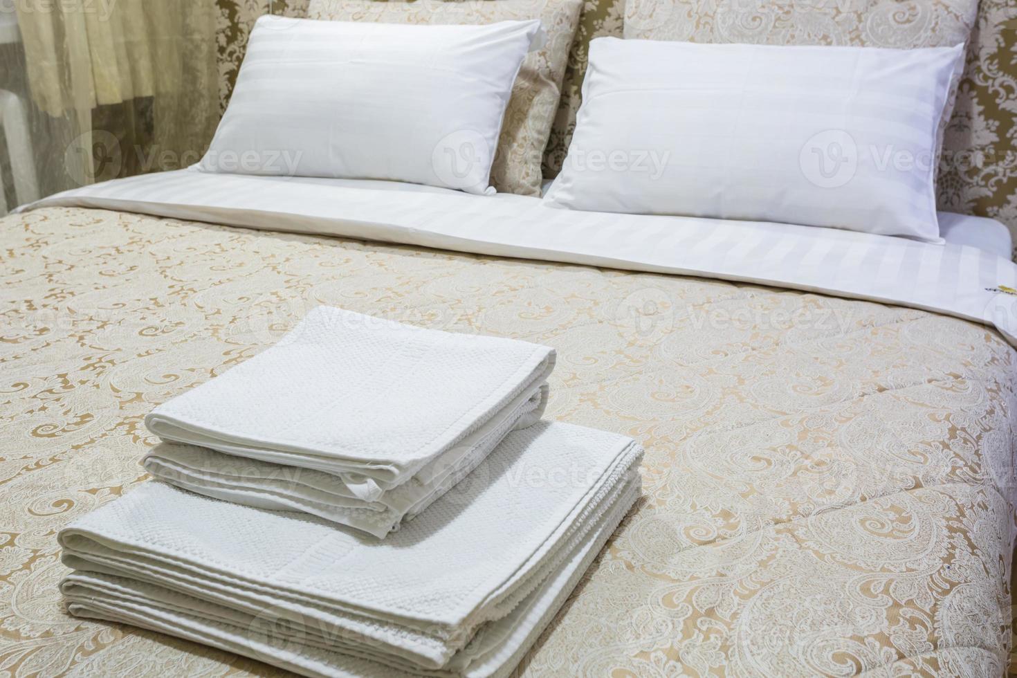 pillows on the bed in Interior of the modern bedroom in loft flat apartments in light color style photo