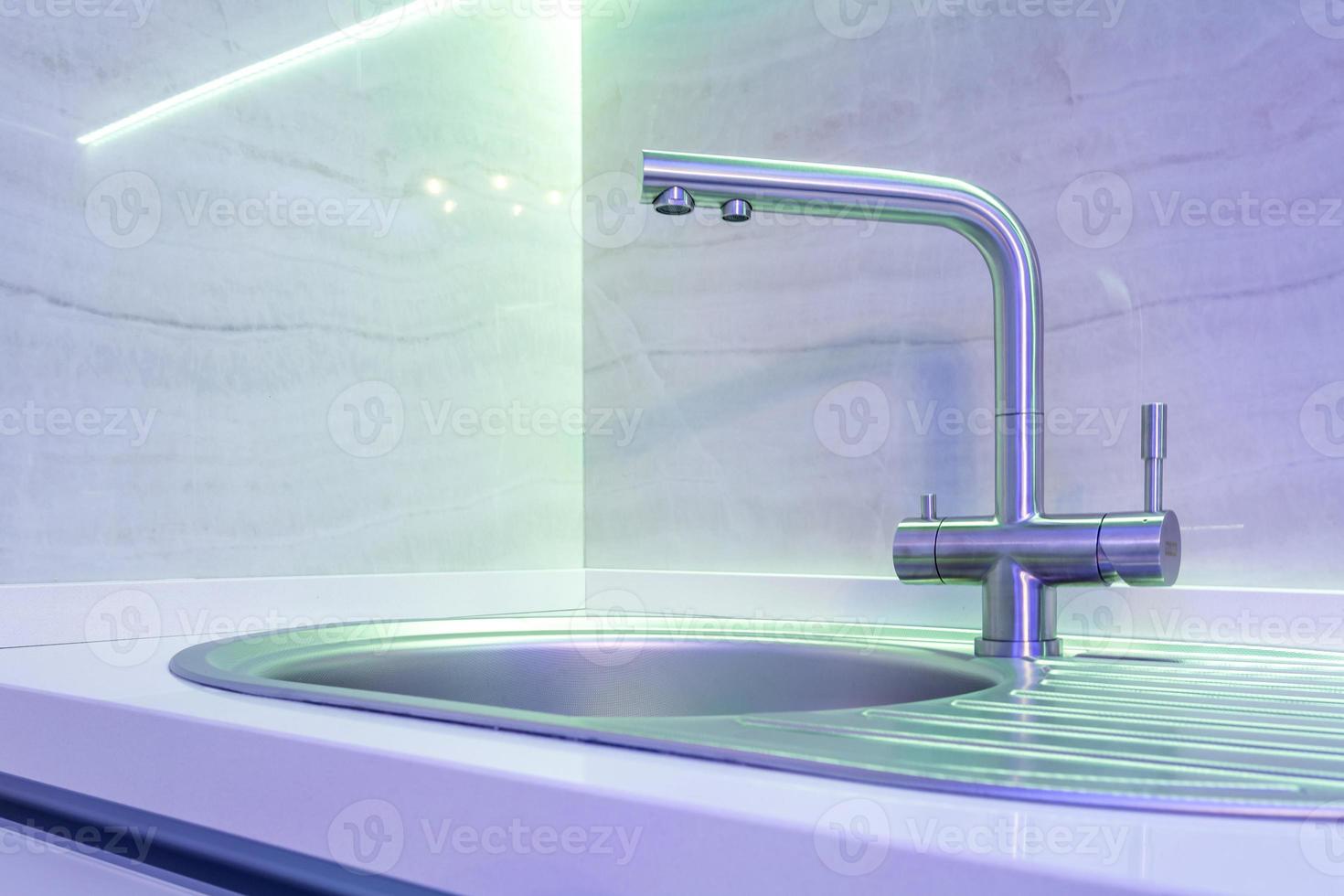 Water tap sink with faucet in expensive loft kitchen photo