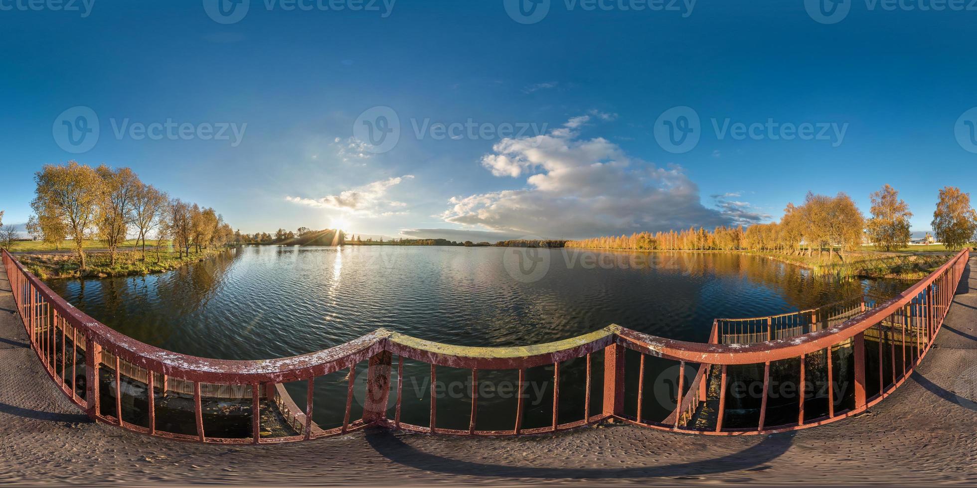 full seamless spherical panorama 360 degrees angle view golden autumn near the dam of wide lake in sunny day. 360 panorama in equirectangular projection, ready VR AR virtual reality content photo