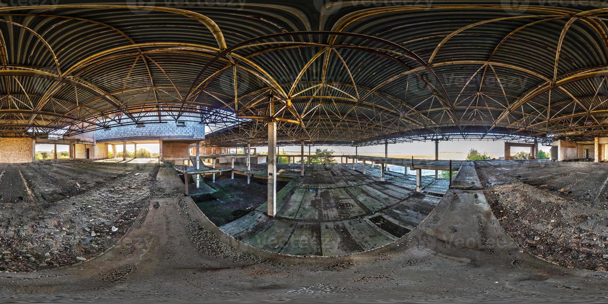 Full spherical seamless hdri panorama 360 degrees angle view concrete structures abandoned unfinished building of airport in equirectangular equidistant projection, VR AR content photo