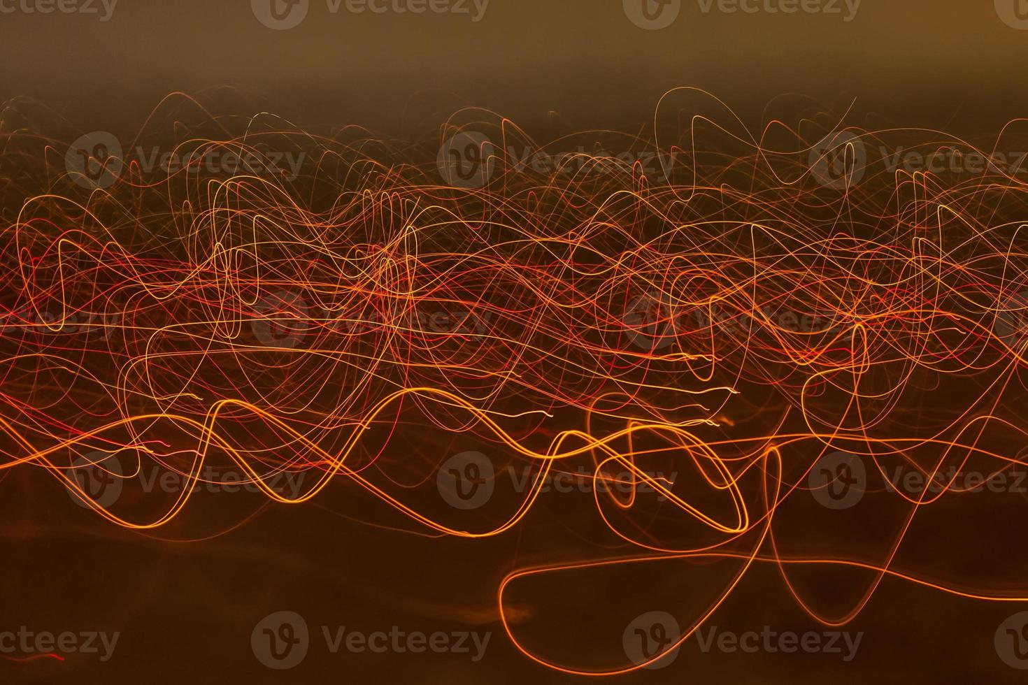 Different light painting photography color abstractions of light. curves and waves of neon light against black background photo